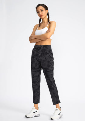 Soothfeel women's pants lifestyle shot showcases golf, travel, and active wear versatility.