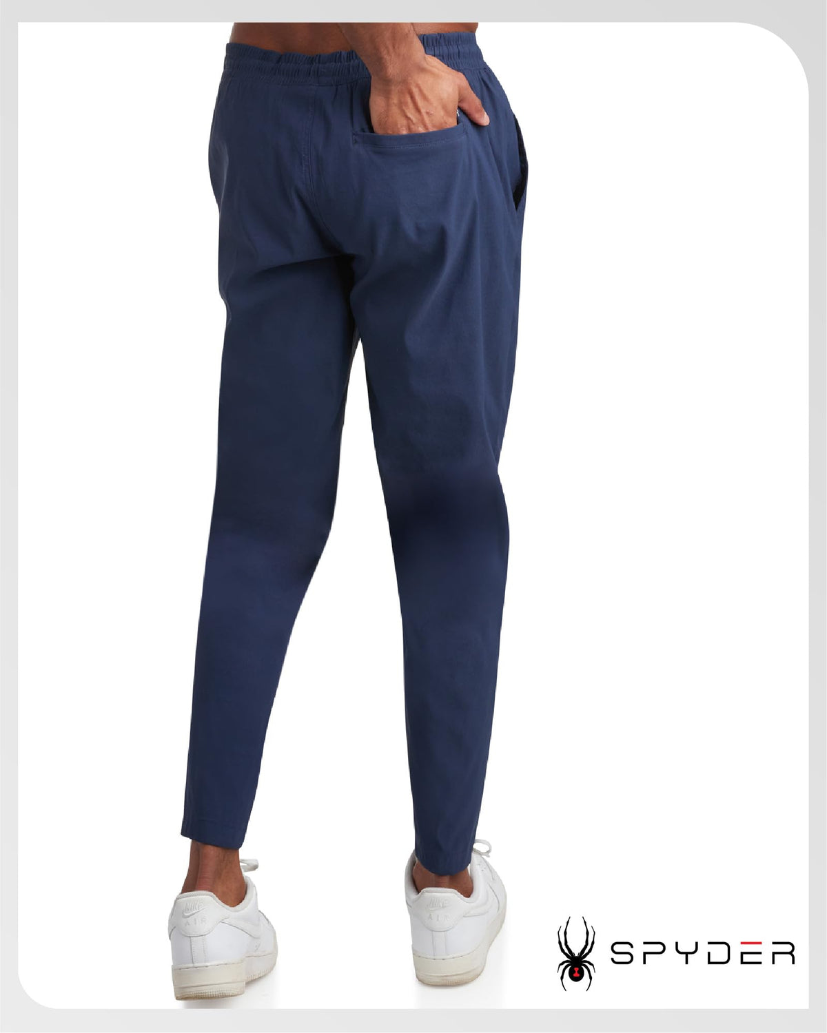 Spyder men's work pants adjustable waistband, side view showing flexible fit for movement.