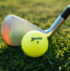 Srixon Soft Feel 13 Yellow ball on green for quick lineups.
