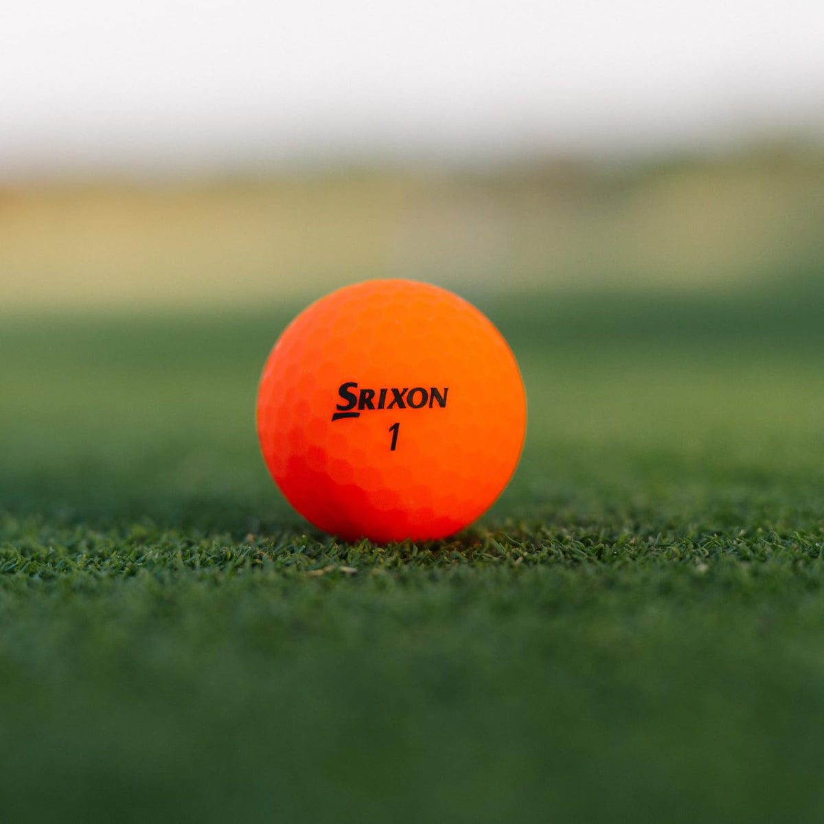 Golfer on tee demonstrates longer drives with higher launch using Srixon Soft Feel.