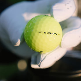 Srixon Z-Star Diamond Yellow ball on tee for higher launch