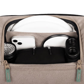 Adjustable chest strap with shock absorbing webbing balances weight on the Voyager