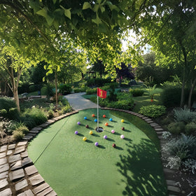 StrikeEdge purple balls on indoor surfaces support kids' mini golf drills.