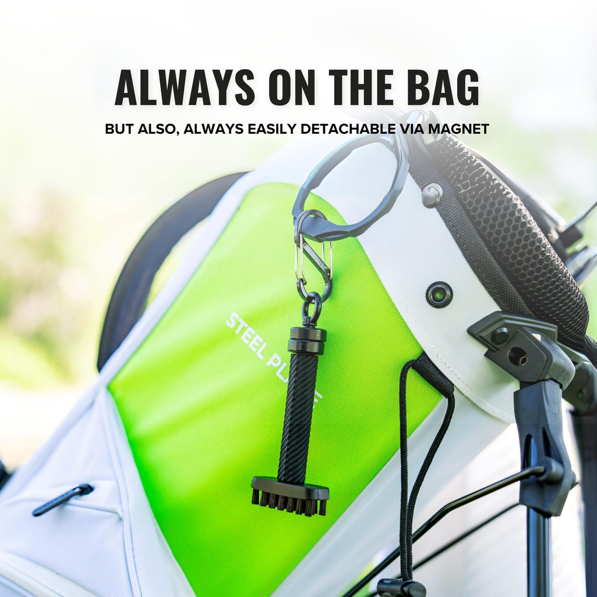 Stripebird golf bag accessory cleaner brush in action on a club.