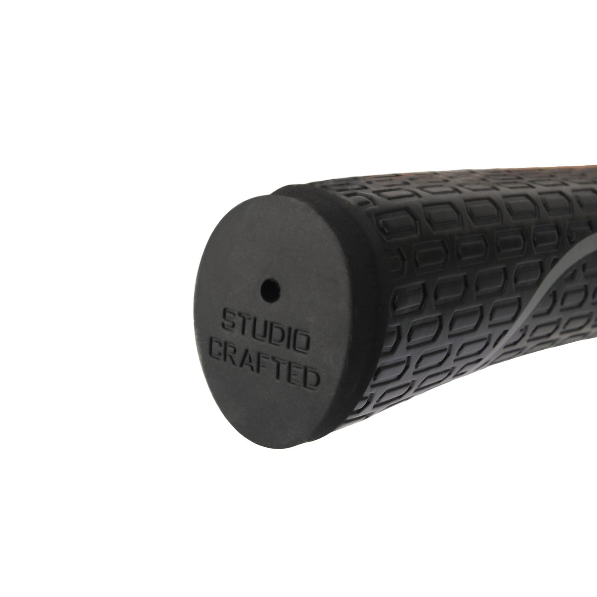 Studio Crafted black putter grip in hand on green for alignment.