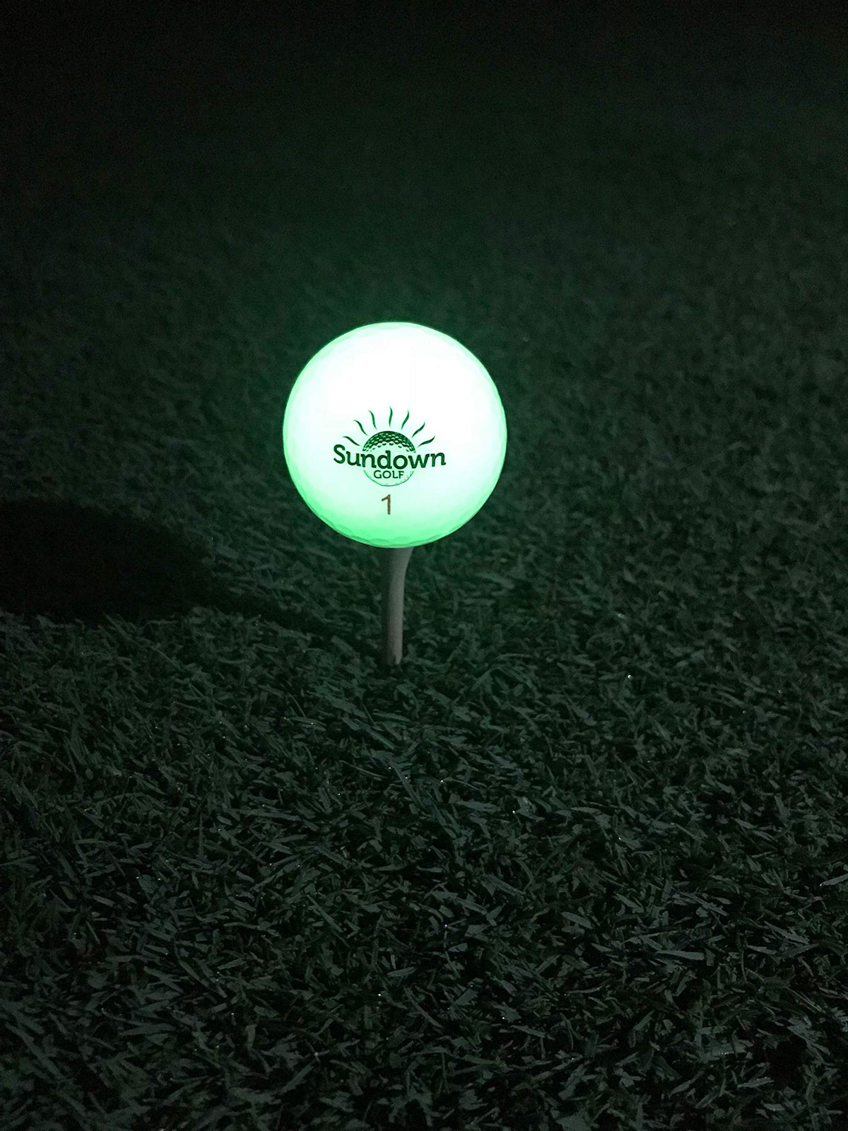 SUNDOWN GOLF glow ball durable phosphorescent coating resists sand and water.