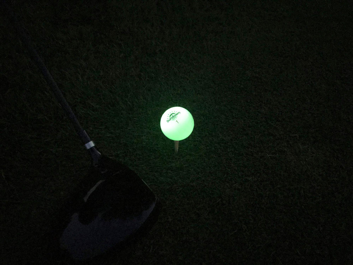 SUNDOWN GOLF glow ball includes two UV flashlights for charging.