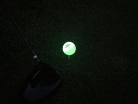 SUNDOWN GOLF glow ball includes two UV flashlights for charging.