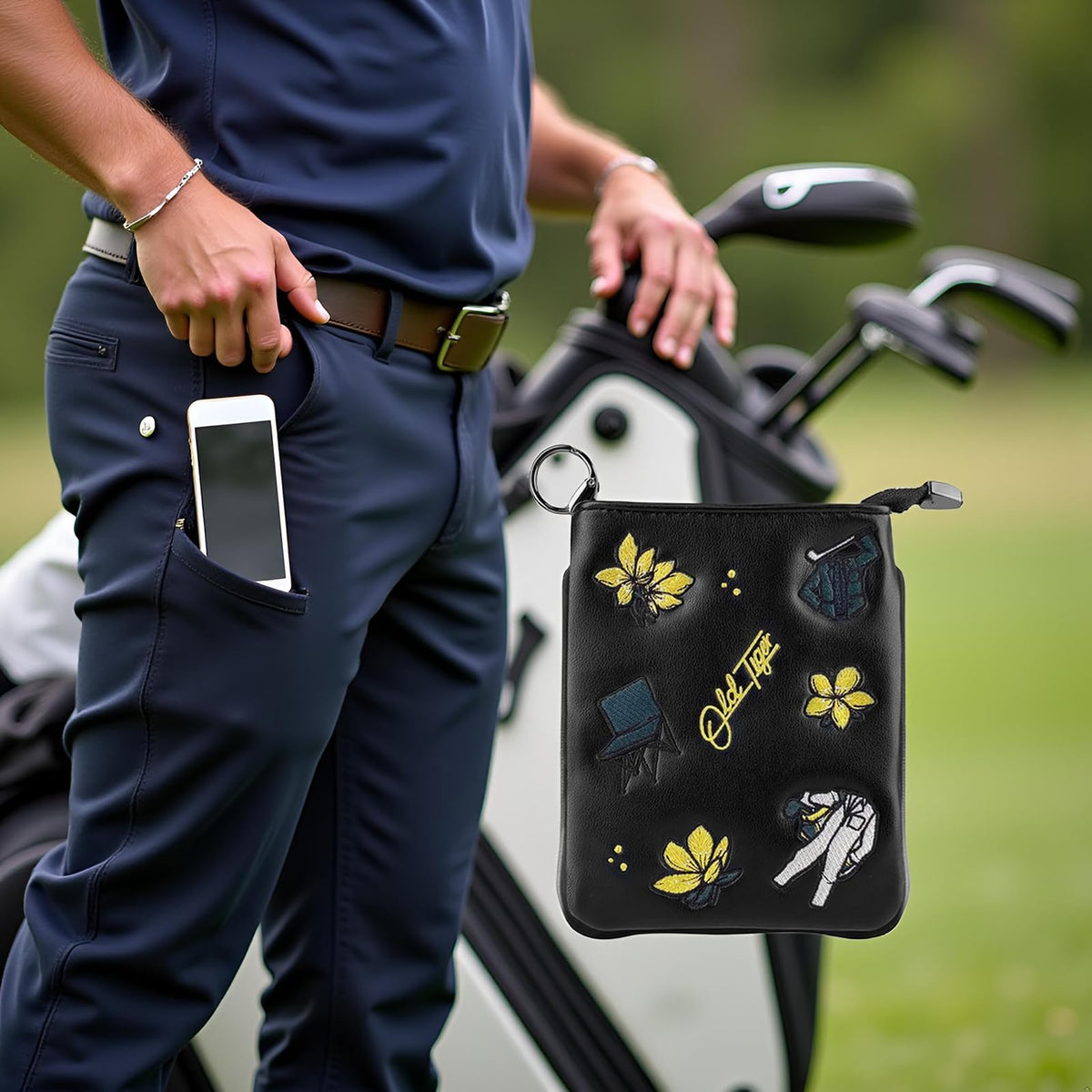 Swig Sip golf pouch waterproof material protects valuables on wet courses.