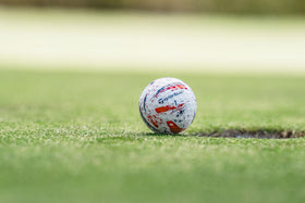 TaylorMade SpeedSoft Ink ball texture close-up highlights ultra-low compression feel.