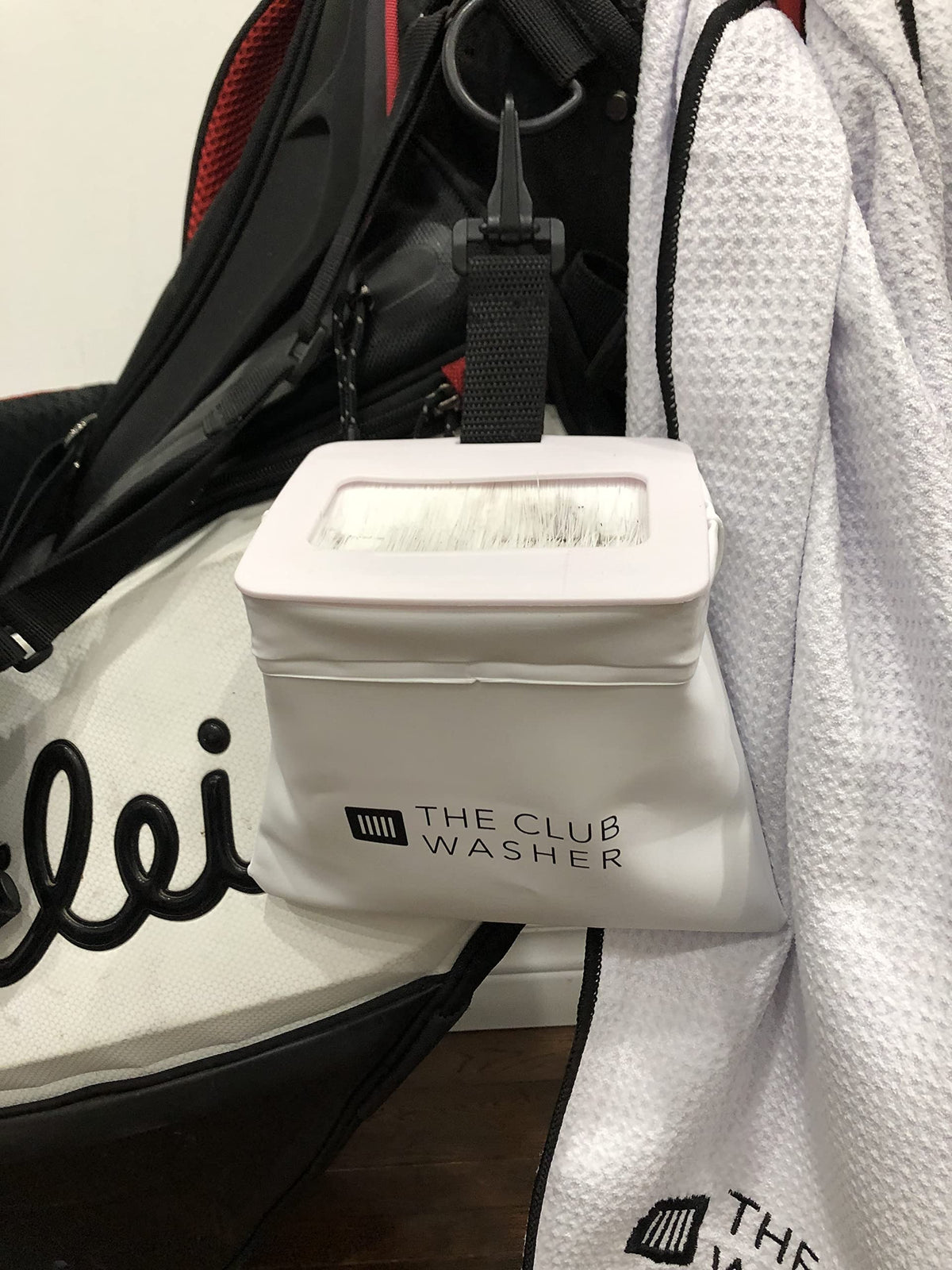 The Club Washer clips onto any bag for portable cleaning