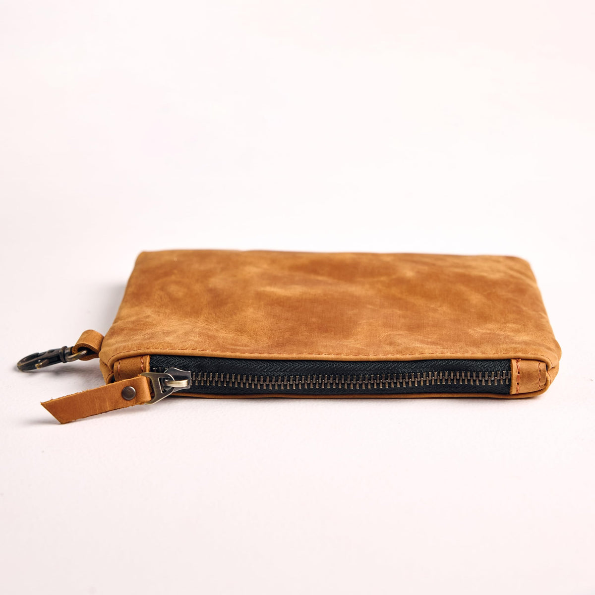 TORAKIP warm brown leather pouch complements any golf gear setup