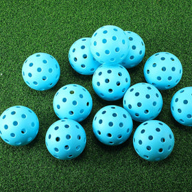 Tradder blue 2.9-inch practice golf balls in use during training.