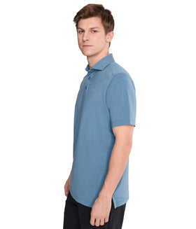 TravisMathew Heater Active Polo left chest branding adds subtle style detail