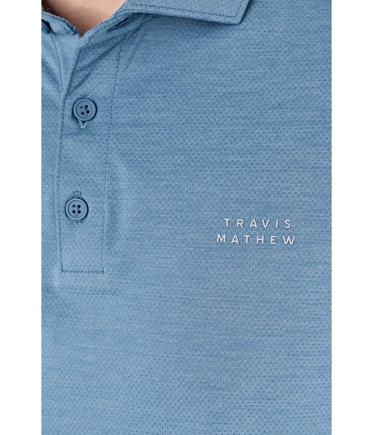 TravisMathew Heater Active Polo worn in a casual scene for versatile styling