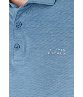 TravisMathew Heater Active Polo worn in a casual scene for versatile styling
