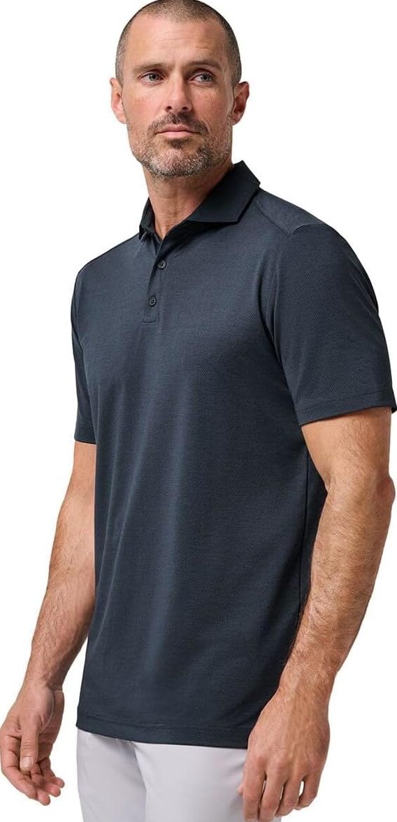 TravisMathew Heater Active Polo Total Eclipse; close-up fabric texture and refined collar detail.