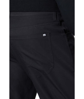TravisMathew Open to Close Black 30 back view reveals clean casual style