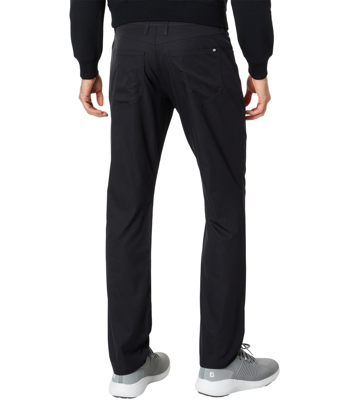 TravisMathew Open to Close Black 33 side view pant with flexible mobility for work and weekend