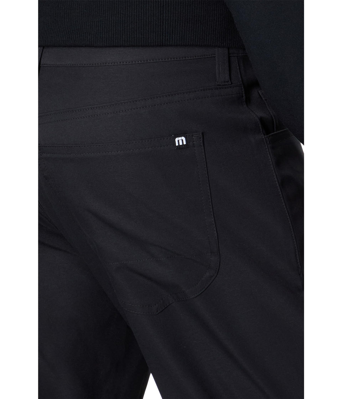 TravisMathew Open to Close Black 40 pant waist detail showing classic 5-pocket design.