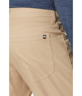TravisMathew Open to Close Khaki 33 pant back view showing classic 5-pocket design for everyday wear.