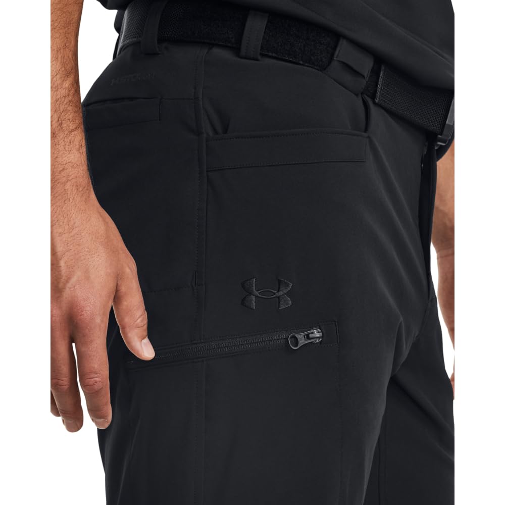 Under Armour Defender pants, side view; flexible movement for dynamic activities.