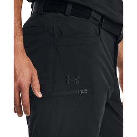 Under Armour Defender pants, side view; flexible movement for dynamic activities.
