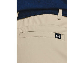 Under Armour Drive Pants in action on the course, movement ready.