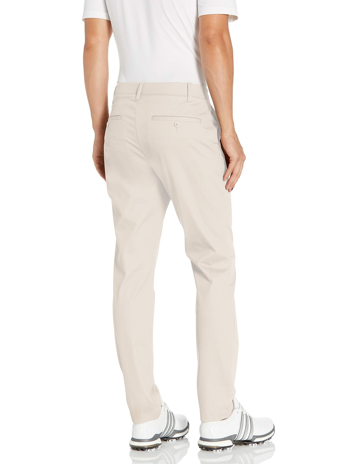 Under Armour Showdown pants worn on a golfer demonstrating tapered fit and range of motion