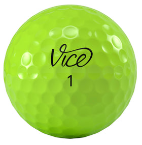 Vice Golf Pro Plus Lime balls on a tee showing bright color and spin potential