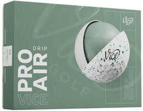 Vice Pro Air ball in flight with petrol-yellow drip, showcasing distance and launch potential.