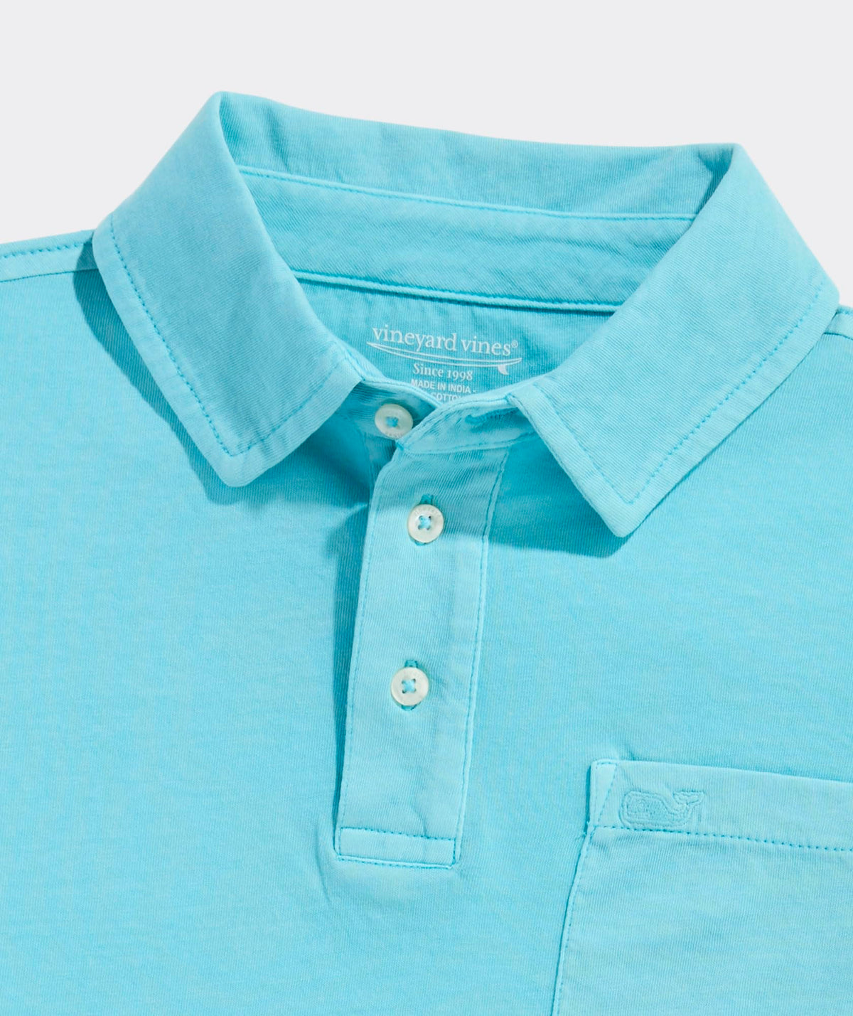 Vineyard Vines polo pocket close-up with whale logo and durable color