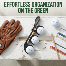 Virsomier golf ball and tee holder clipped to clothing for convenience.