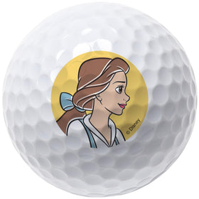 Side-angle view of four Belle balls highlighting artwork detail on white golf balls.