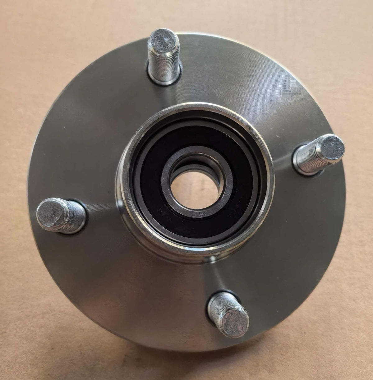 Wantone Racing steel front hub with bearing included for durable performance.