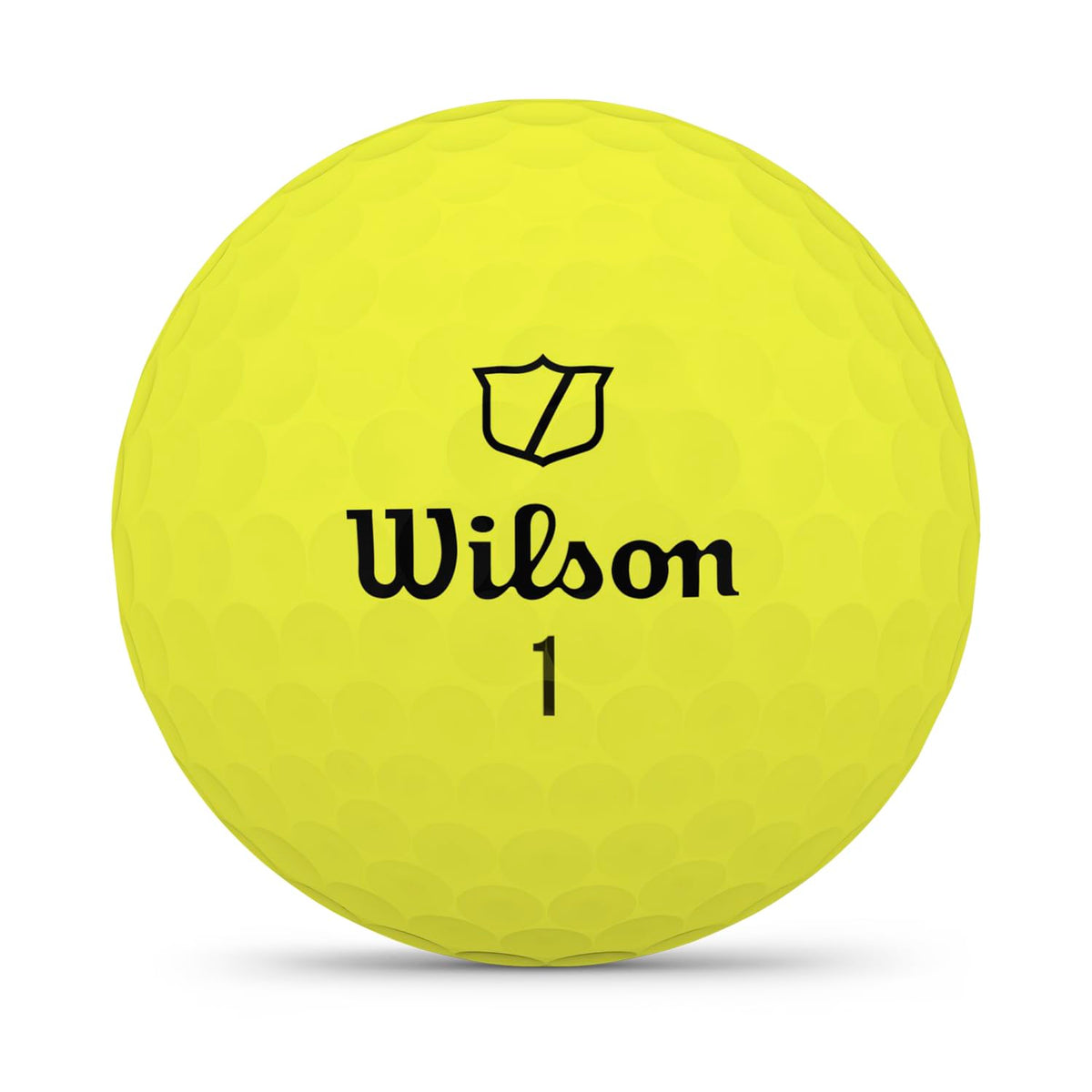 Wilson 2026 Staff Model ball on a tee illustrating penetrating flight and low tee spin