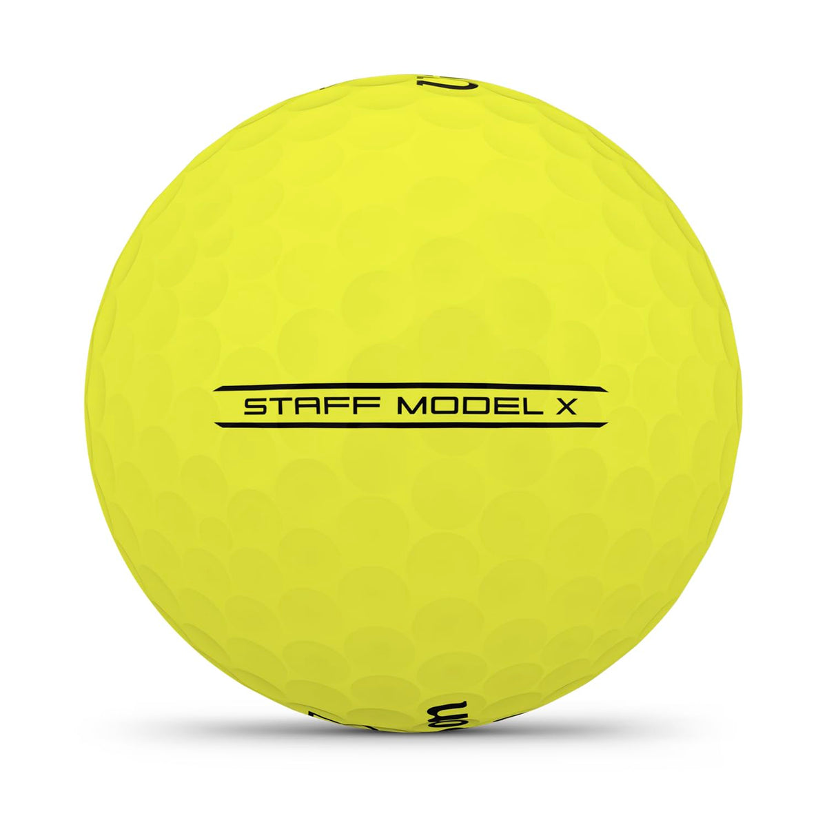 Wilson 2026 Staff Model X yellow ball on tee, showcasing a firm compression core
