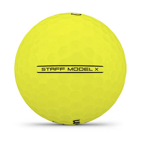 Wilson 2026 Staff Model X yellow ball on tee, showcasing a firm compression core
