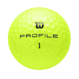 Wilson Profile Distance yellow balls held for scale on a practice range