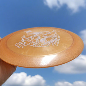 Yikundiscs Phoenix Star Distance Driver in orange suited for outdoor competition.