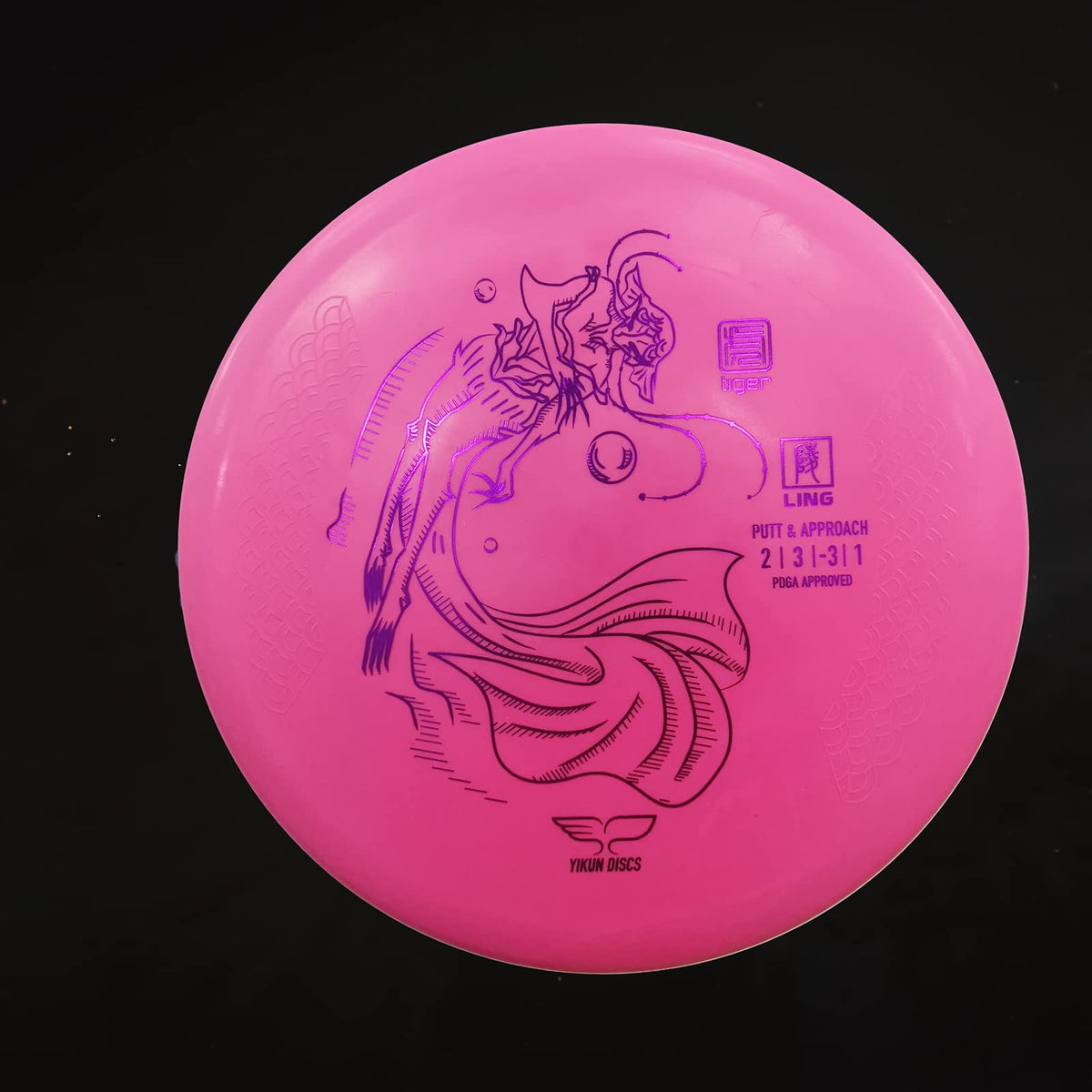 Yikundiscs Yikun pink-on-green-field disc ready for practice.