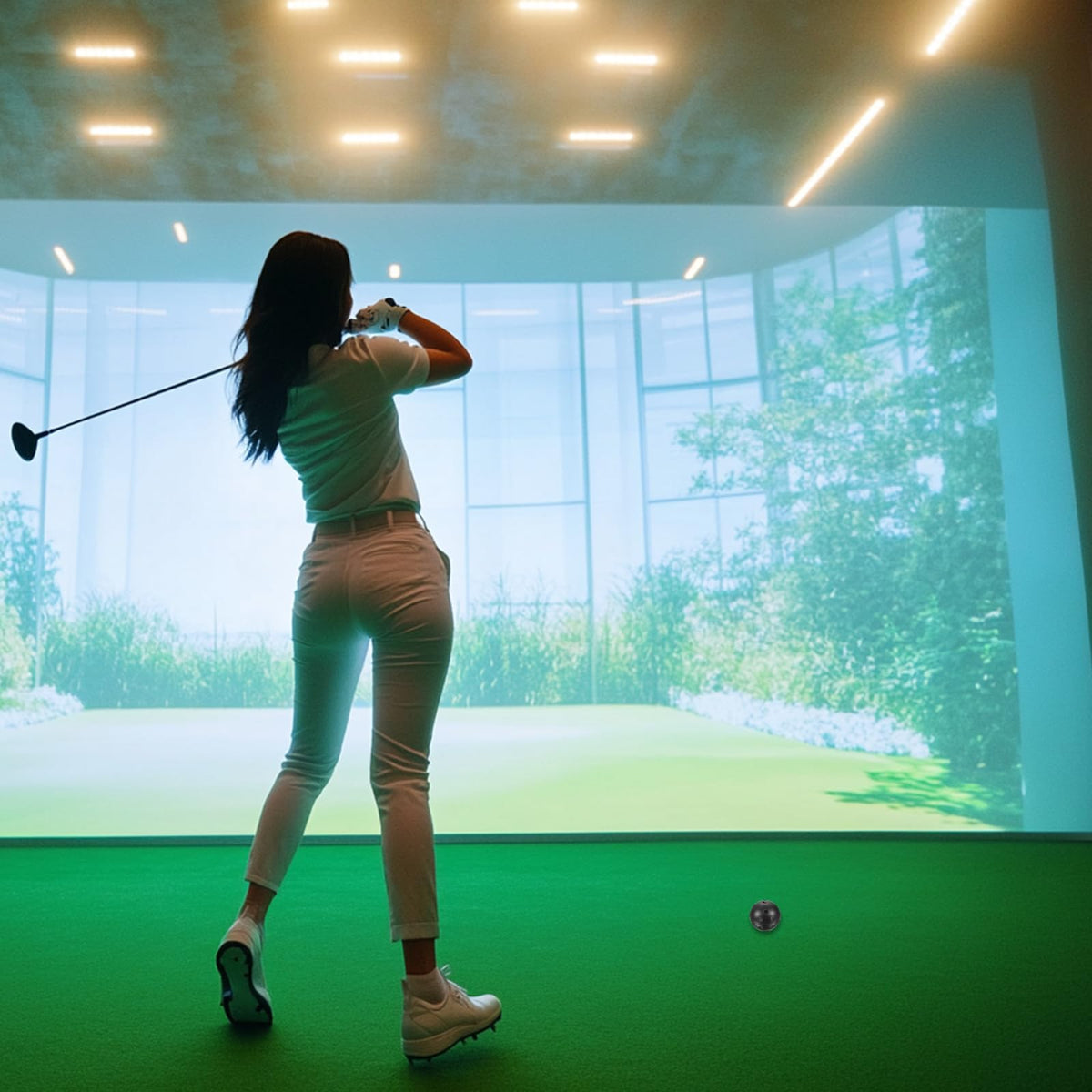 YOKIVE indoor golf practice image shows safe use on mats and compact spaces.