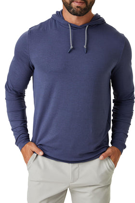 ZIRE Golf hoodie side profile showing lightweight layering for travel and daily use.