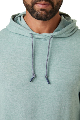 ZIRE Golf Men's Performance Hoodie side stretch shot illustrating four-way stretch for range of motion.